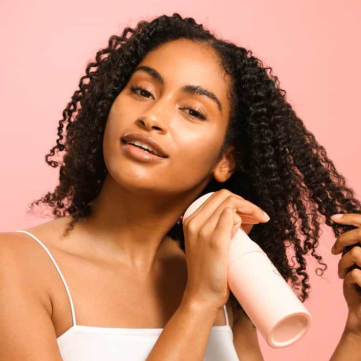 Only Curls Misting Bottle being used to spray hair - Only Curls