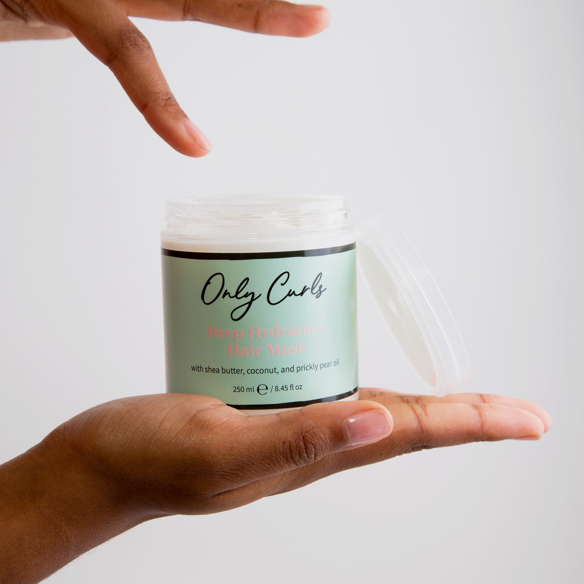 Only Curls Deep Hydration Hair Mask using finger to sample